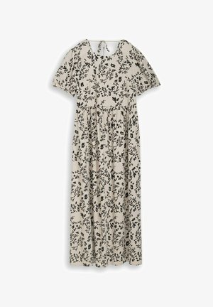 Robe maxi beige clair avec imprimé floral noir, manches courtes bouffantes, taille froncée, encolure ronde et fermeture à nouer dans le dos.