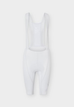 Weiße Radhose mit gepolstertem Sitz, elastischen Trägern und körpernahem Design, dargestellt auf einem einfarbigen hellen Hintergrund.