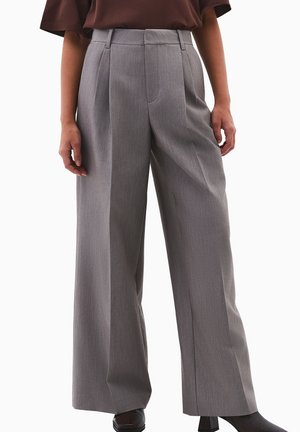 - Spodnie materiałowe