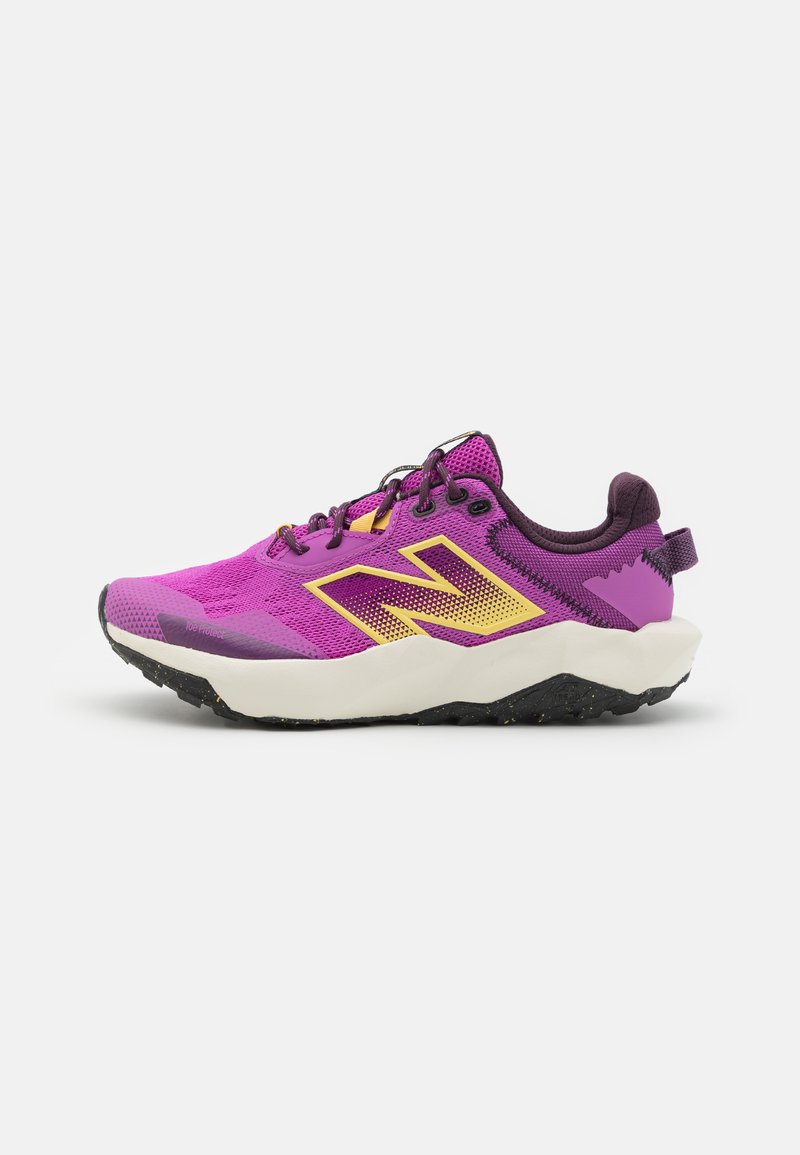 Purple textile athletic shoe with yellow accents, mesh upper, padded collar, and black outsole featuring grip patterns.
