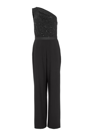 Combinaison noire avec un design asymétrique sur une épaule, un dessus en dentelle texturée et des pantalons larges, accentués de subtils sequins et d'une ceinture.