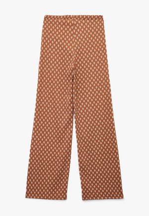 Brune mønstrede bukser i bred ben med et diamantmotiv i hvid. Blødt stof, elastisk talje og hel-længde design.
