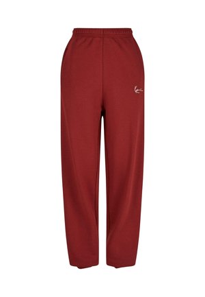 Bordové tepláky s uvolněným střihem, elastickým pasem a bílým logem na levé straně. Vyrobené z měkké, strukturované tkaniny.