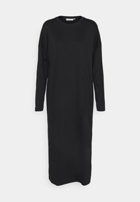 Vestido negro de manga larga hecho de tela suave, que presenta un escote redondo y un corte holgado. Diseño sencillo sin patrones ni acentos.