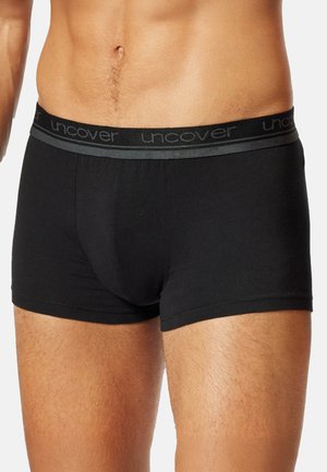 Male torso wearing black boxer briefs with gray waistband featuring "unc" visible in logo repeated around waist.