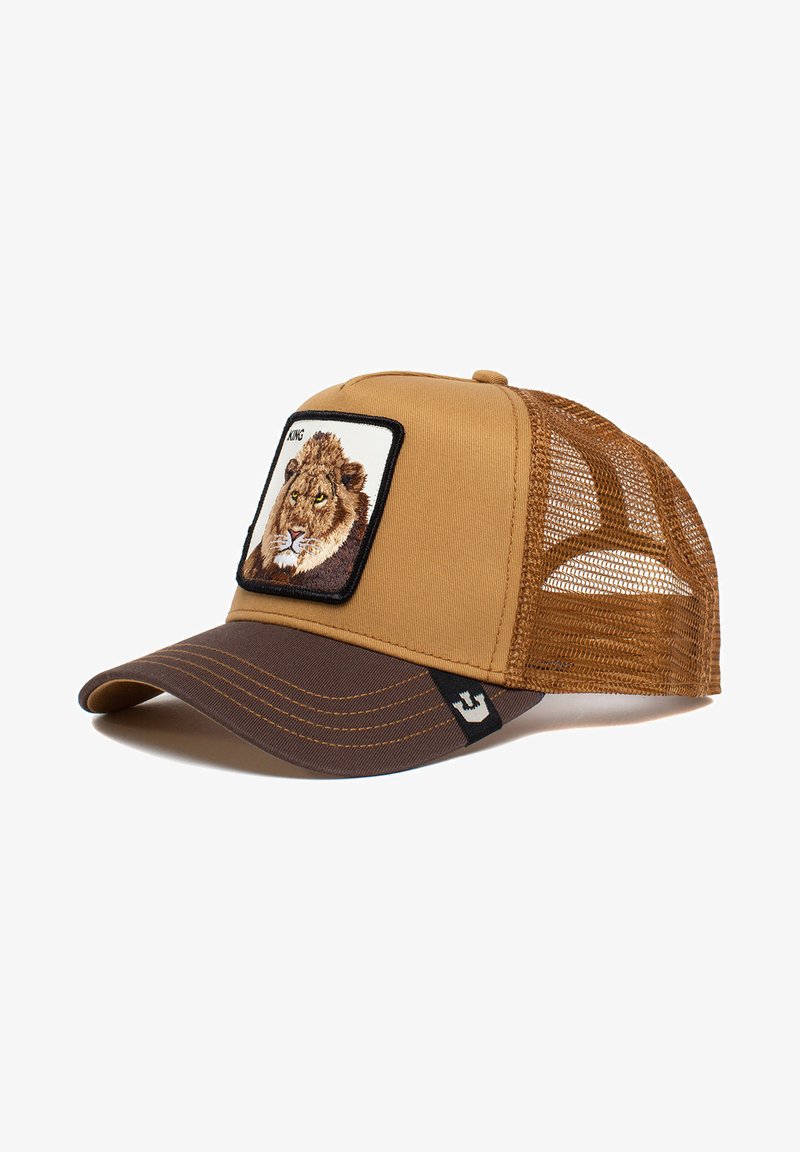 Brown cap with mesh back, featuring a lion embroidery on front patch. Curved brim with contrasting dark brown underside and stitching details.