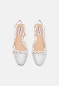White satin slingback shoes with transparent mesh accents and beaded embellishments. Round toe and flat heel design.