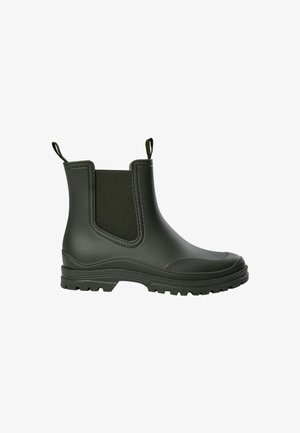 Bota de tobillo de goma negra con paneles laterales elásticos, suela texturizada, lengüeta trasera y acabado liso. Apta para condiciones húmedas.