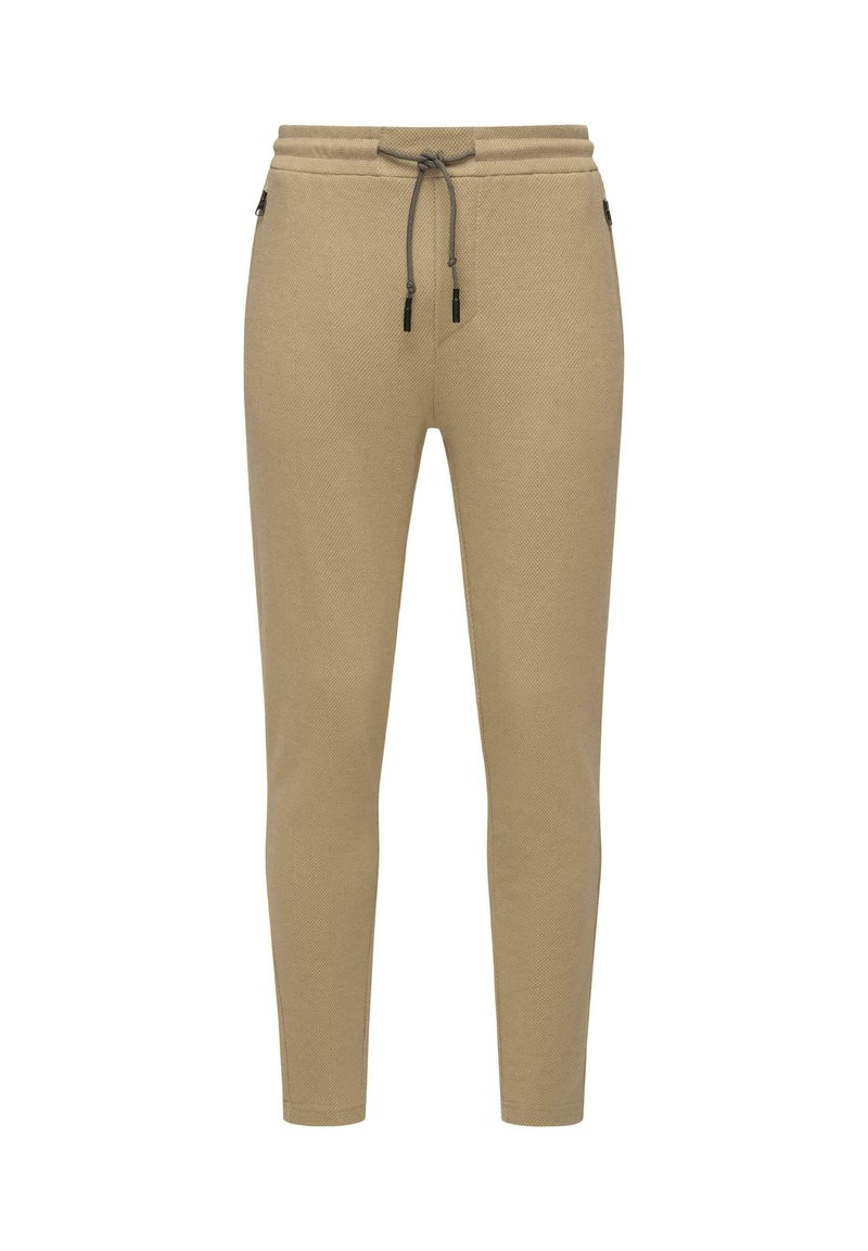 Beige jogger nadrág strukturált anyagból, rugalmas derékkal és húzózsinórral, tapered lábakkal és oldalsó cipzáras zsebekkel.