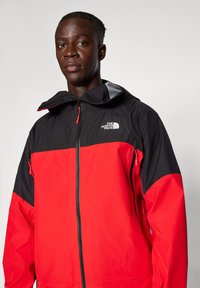 The North Face JAZZI JACKET - Veste Hardshell - high risk red/black