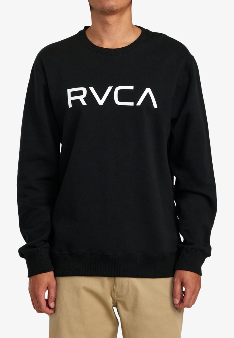 Sweatshirt noir en coton avec un col rond. Présente un logo "RVCA" en blanc audacieux sur la poitrine et des poignets et un ourlet côtelés.