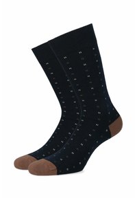 Granatowe skarpetki w białe i brązowe kropki. Wzmocniony brązowy palec i mankiet. Miękka tkanina o prążkowanej teksturze dla wygody.
