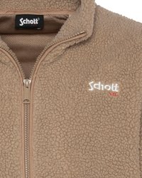 Brązowa polarowa kurtka zapinana na zamek, o teksturowanej powierzchni, miękkim wykończeniu i kontrastowym beżowym zamku. Posiada logo Schott na piersi w kolorze białym i czerwonym.