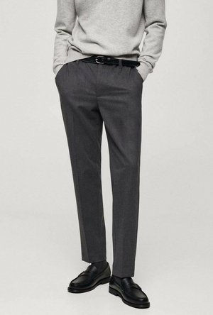 Gray fabric trousers with a straight cut, featuring a subtle texture, belt loops, and a black belt; paired with black loafers.