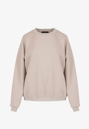 Przesadny beżowy sweter z okrągłym dekoltem, z prążkowanymi mankietami i dolną krawędzią, wykonany z miękkiego materiału, z opadającymi szwami na ramionach.