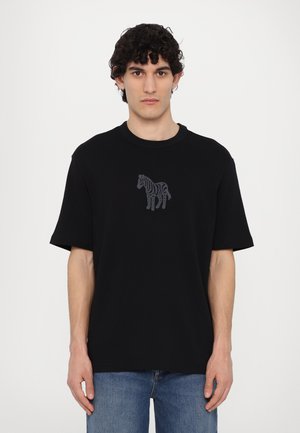 Zwarte korte mouwen T-shirt van katoen, met een grijze zebraafbeelding op de borst, voorzien van een ronde halslijn en een relaxte pasvorm.