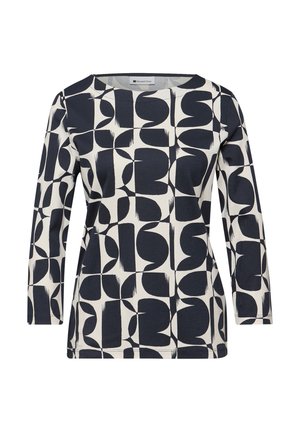 Chemise à manches longues avec motif géométrique abstrait carré noir et blanc et encolure ronde.