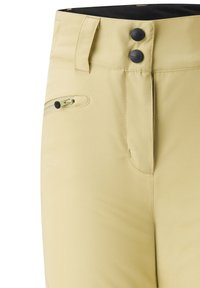 Helle gelbe Performance-Hosen mit einem Reißverschlusstasche, doppeltem Knopfverschluss und strapazierfähigem Stoff; verfügen über ein elegantes, tailliertes Design.