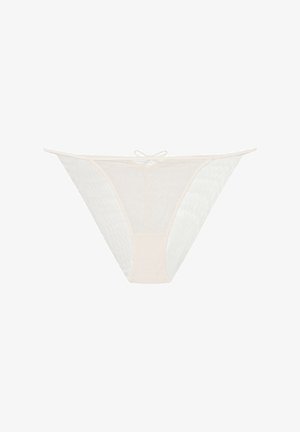 Lace and mesh thong in soft beige, featuring a low-rise design, cut-out sides, and a small bow detail at the center back.