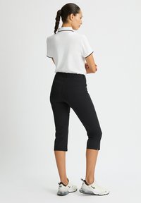 Röhnisch Pantalón 3/4 de deporte - black