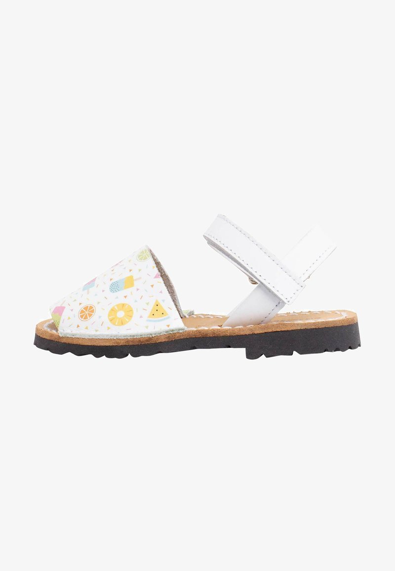 Children's sandals with a white base, featuring a colorful fruit and ice cream pattern on the upper. Brown sole with textured grip.