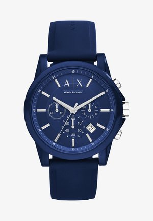 Niebieski zegarek na silikonowym pasku z teksturowaną niebieską tarczą, srebrnymi znacznikami godzinowymi, subtarczami i wyświetlaczem daty na 6 godzinie. Funkcjonalność chronografu.