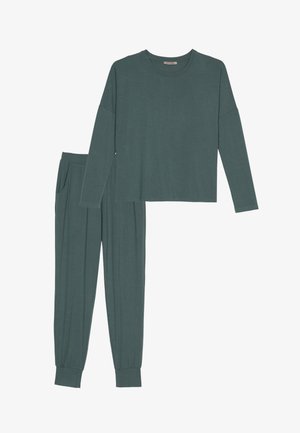 Ensemble de salon teal comprenant un haut à manches longues avec un col rond et une coupe décontractée, associé à un pantalon fuselé avec poches latérales. Texture douce, léger.