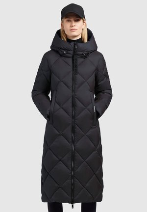 Black quilted longer puffer coat with a high collar, front zipper, and two side pockets. Features a hood and a subtle brand logo detail.