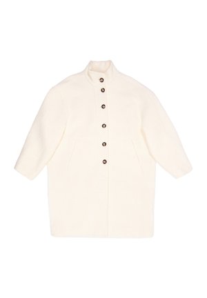 Płaszcz w kolorze kremowym z wysokim kołnierzem, zapięciem na guziki i dwoma przednimi kieszeniami. Wykonany z teksturowanej tkaniny o luźnym, oversize'owym fasonie.