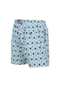 Costume da bagno blu chiaro con un motivo ripetuto nero e verde che raffigura bevande tropicali, elastico in vita e una tasca sul retro.