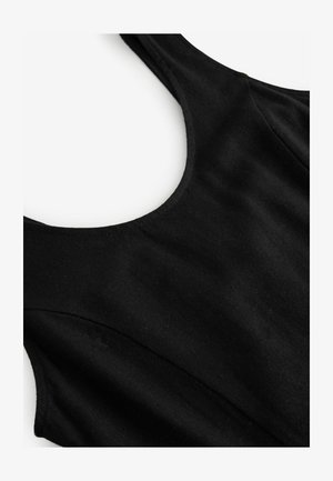 Mustassa hihattomassa mekossa on pyöreä kaula-aukko, se on valmistettu sileästä kankaasta, ja siinä on hienovarainen tekstuuri ilman näkyviä kuvioita tai metalliosia.