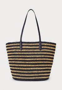 Melna un zelta svītrota austā soma ar divām izturīgām melnām rokturiem. Apaļa forma, teksturēts materiāls un atvērta augšdaļa.