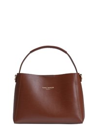 Brown leather handbag with curved top handle, gold hardware, and embossed logo on the front. Smooth texture and structured silhouette.