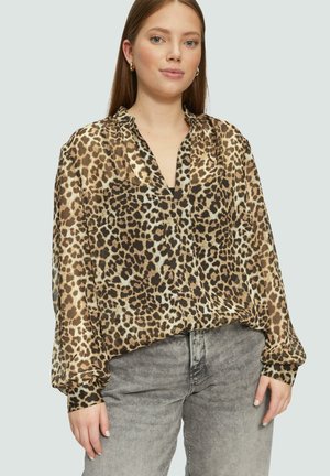 Blouse à imprimé léopard avec des manches longues, décolleté en V et épaules froncées. Fabriquée en tissu léger dans des nuances de marron et de crème.