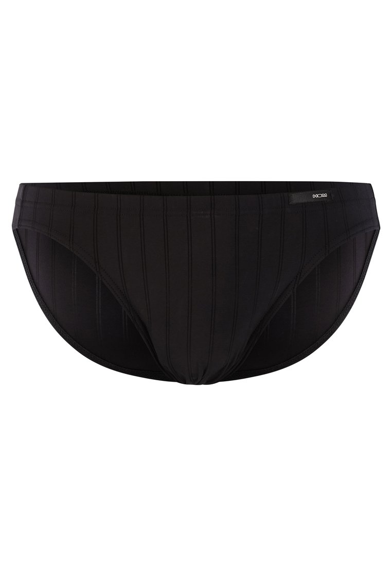 Svarta simbyxor med en texturerad ribbad yta, elastiskt midjeband och en liten märkesetikett på sidan. Mjukt, elastiskt tyg.