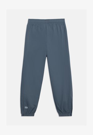 Ciemnoszare spodnie sportowe z elastycznym pasem i mankietami, z małym logo "Ultra Dry" blisko lewej kostki.