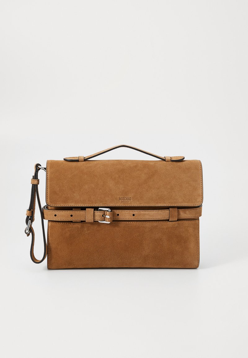 Brown suede handbag with a structured design, a top handle, a detachable strap, and a belt accent. Features a logo on the front.