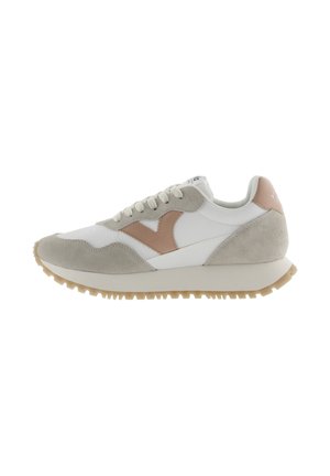 Sneakers featuring a mix of white leather and grey suede, with a brown accent. The sole is beige with a textured, ridged pattern.