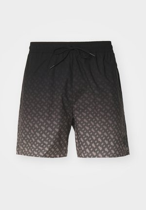 Shorts de bain noirs avec un motif ombragé, présentant un design géométrique. Taille élastique avec cordon de serrage. Texture légère et lisse.