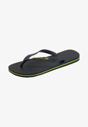Infradito neri con una soletta testurizzata, cinturini in gomma e un accento giallo, verde e blu sulla suola. Design leggero e flessibile.
