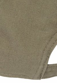 Olive green, textured fabric in a diagonal weave, with clean edges and a visible seam. Simple, practical design featuring a cutout detail.