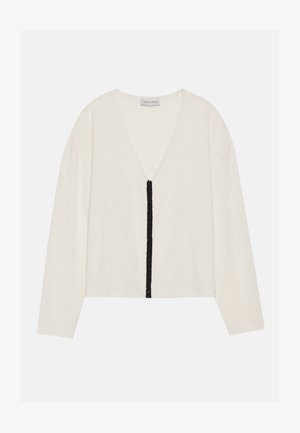 White long-sleeve top with a v-neck and a central black textured stripe along the front. Soft fabric with a relaxed fit.