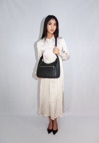 Adax LUCY - Cross body bag - black