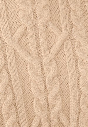Tessuto beige a maglia cable con motivi intrecciati e torciglioni, dall'aspetto morbido e testurizzato, con leggere variazioni di spessore.