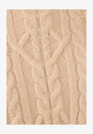 Beige kabelgebreide stof met verweven gedraaide patronen en een zachte, gestructureerde uitstraling, met lichte variaties in dikte.