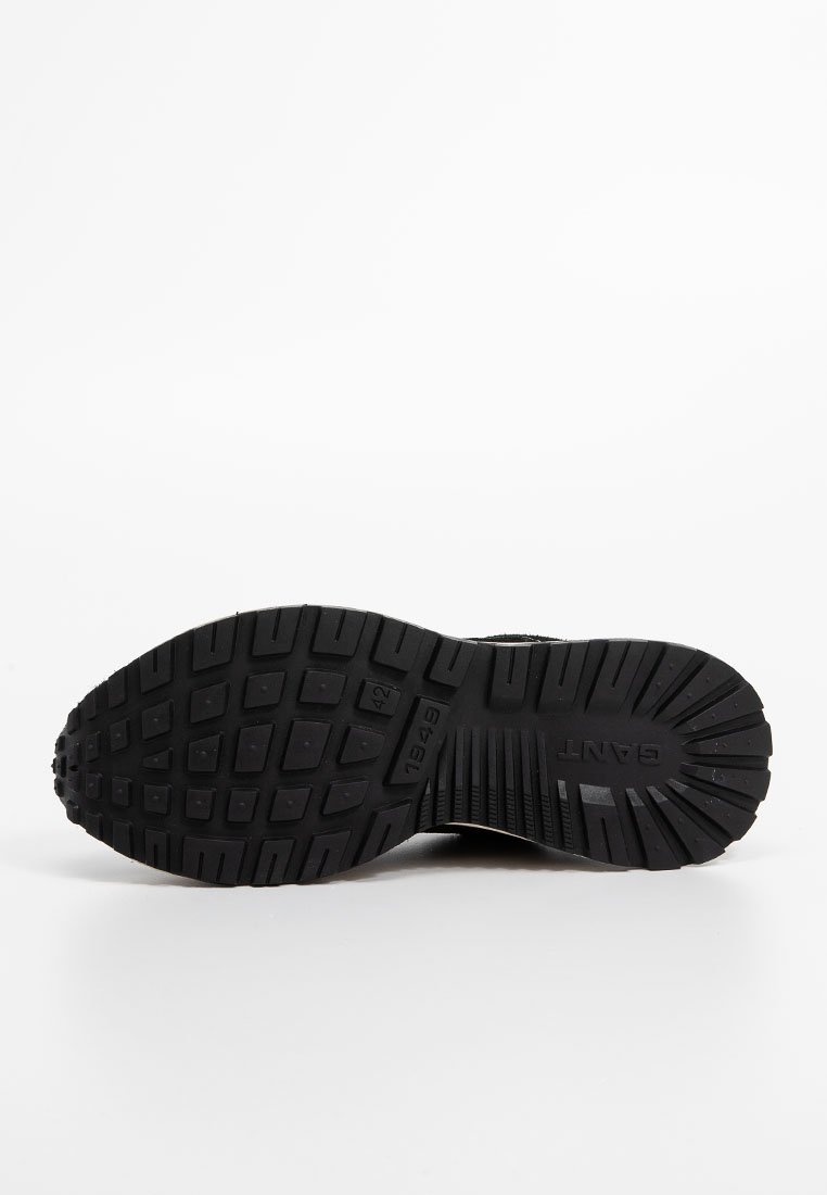 Semelle en caoutchouc noir avec un motif, taille 42, et le nom de la marque "GANT" visible sur le dessous.