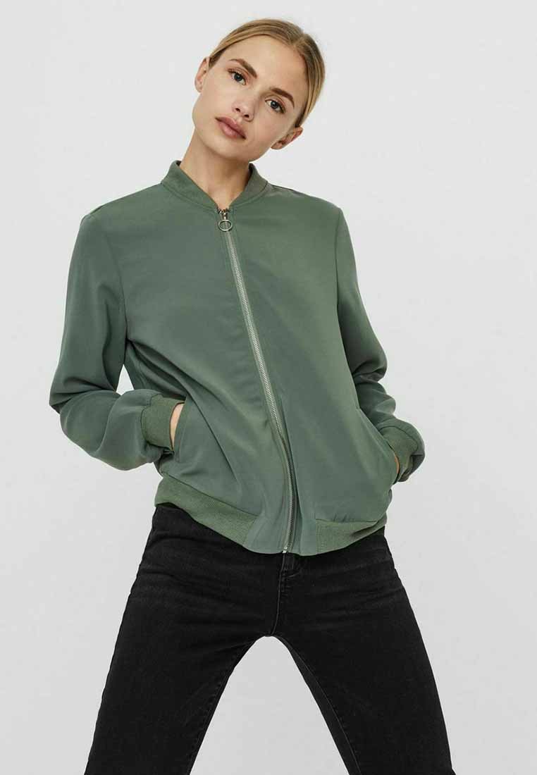 Green bomber jacket with a front zipper, ribbed cuffs, and hem. Smooth texture with side pockets and a stand collar design.
