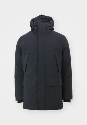 Navy blue insulated jacket with a high collar, adjustable hood, and two large front pockets. Smooth, matte fabric finish, long sleeves.