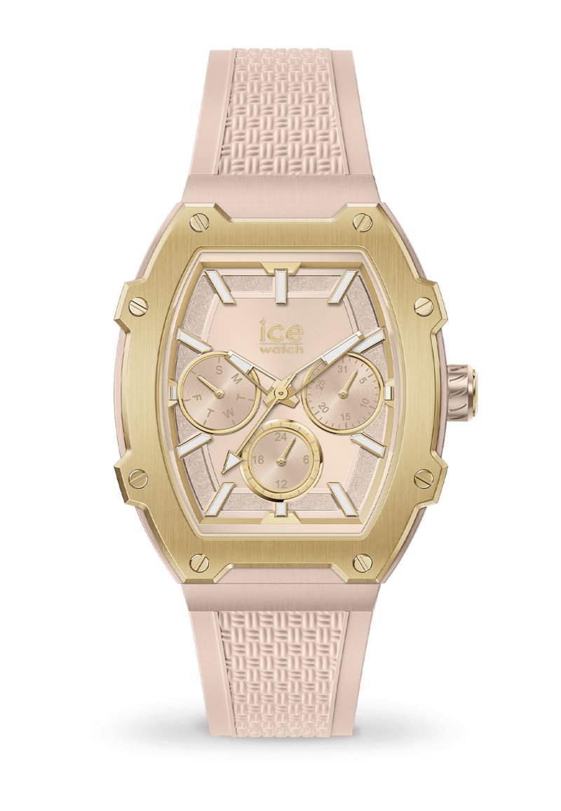 Montre avec un bracelet en silicone rose et un cadran octogonal doré, un cadran texturé rose clair et trois sous-cadrans pour les fonctionnalités de date et d'heure.