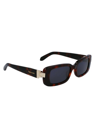 Ochelari de soare cu lentile dreptunghiulare din tortoise shell. Accente de metal aurit pe brațele ochelarilor. Finisaj mat pe brațele templei. Lentile închise la culoare.